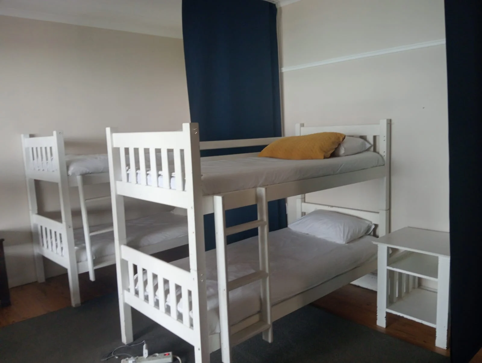 Bunk beds in the dorm at Beach House Backpackers